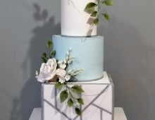 Stacked tiered cake with a square bottom tier